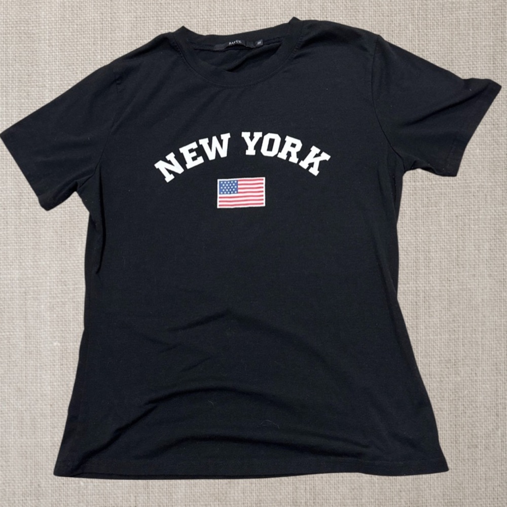 Black t-shirt with New York and American Flag printed on front by Zaful